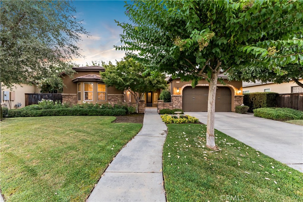 Discover your dream home in this stunning 3-bedroom, 2-bath residence nestled in a peaceful cul-de-sac. As you step inside, an inviting open concept living space welcomes you, adorned with elegant crown molding and pristine tile flooring. The cozy carpet in the bedrooms adds warmth, ensuring comfort throughout. Imagine the possibilities with the versatile den - perfect for a formal dining area, a productive office, or even a fourth bedroom to accommodate your lifestyle needs. The modern kitchen is a chef's delight, featuring a large island topped with exquisite granite countertops, stainless steel appliances that shine, and ample cabinetry for all your culinary essentials. Retreat to the master bedroom, complete with an ensuite bathroom that boasts dual sinks and a luxurious soaking tub for unwinding after a long day. Step outside to your own backyard paradise - relax under the covered patio or enjoy gatherings in the gazebo surrounded by lush artificial grass. This home isn’t just beautiful; it’s designed for your comfort and convenience. Don’t miss out on this incredible opportunity! Schedule your private showing today and see firsthand why this home is perfect for you!