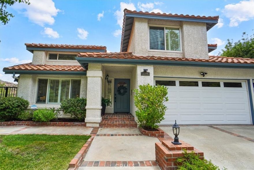 Welcome to this exquisite 5-bedroom, 3-bathroom residence in the coveted Hidden Valley neighborhood of Santa Clarita. This almost 3100-square-foot home sits on a generous pool-sized lot in a serene cul-de-sac, offering the perfect blend of luxury, modern upgrades, and prime location.



Step inside to discover stunning wood floors and a bright, open floor plan. The upgraded kitchen, featuring brand-new stainless steel Cafe appliances (2024), granite countertops, and ample cabinetry, is a chef’s dream. The main level includes a spacious bedroom and a beautifully remodeled bathroom, perfect for guests or multigenerational living. 



Upstairs, four additional bedrooms with newer luxury carpet and fresh paint provide versatility for family, guests, offices, or hobbies.



Spacious primary bedroom featuring two walk-in closets with custom cabinetry, an en-suite bathroom with dual vanities, a soaking tub, and a standalone shower with custom designer picket and herringbone tile, seamless glass shower doors, quartz countertops, dual sinks, recessed lighting and wood look tile floors. 



The private backyard is an entertainer’s oasis, complete with a BBQ area, fire pit, and a soothing waterfall,  spa, all framed by lush landscaping and serene views of the nearby mountains. 



Recent upgrades include a new roof (2024),  paid-in-full solar panels (2024). That’s right paid solar that’s a significant long-term savings on your utility bills. Tesla charger, a newer HVAC system, and energy-efficient windows with custom shutters, ensuring comfort and sustainability. 



Additional highlights include a 3-car garage with built-in cabinets and attic storage, no Mello Roos, and a prime in-town location ideal for commuters. Just minutes from top-rated schools, shopping, dining, and the 5 Freeway, this home offers easy access to Old Town Newhall and local hiking trails. With approximately $100,000 invested in the bathroom remodel alone, this meticulously maintained, move-in-ready home, turn-key, is a rare find in one of Newhall’s most desirable communities. 



The Hidden Valley community offers a unique charm and exclusive amenities that sets it apart. Enjoy a vibrant neighborhood clubhouse, refreshing pool and spa, tennis and pickleball courts, a scenic park, and RV storage.