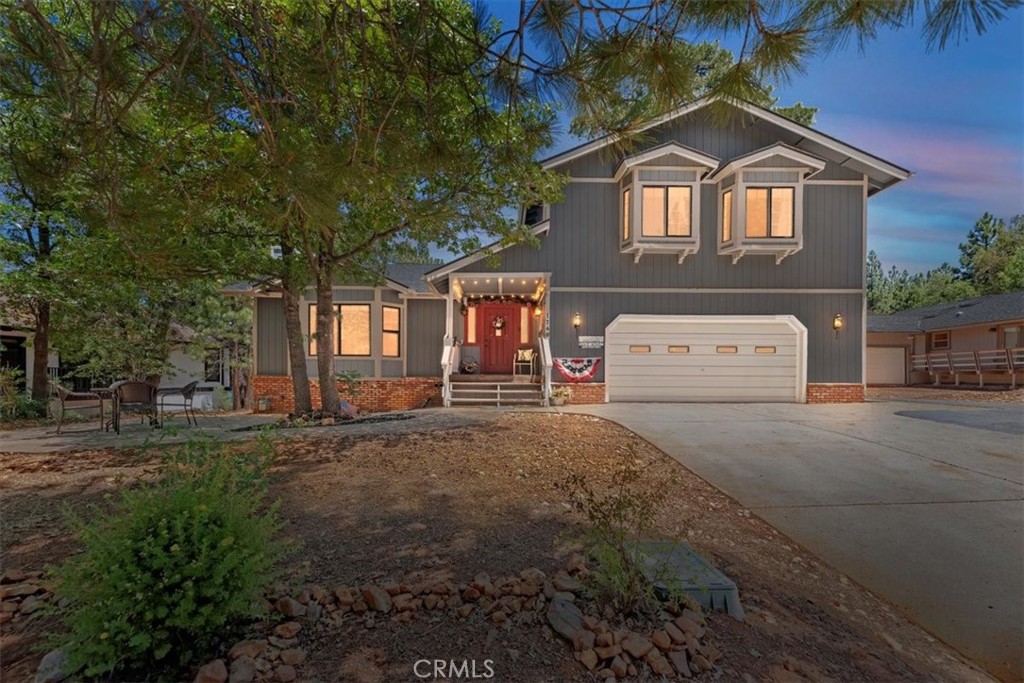 Totally gorgeous remodeled home features an awesome high end kitchen, large kitchen island with bar stools, immense greatroom with beautiful furniture and fireplace also has full dining area with seating for 8, AND a separate game room with wet bar and half bath. All of the living area is open making this a fabulous entertainers' home! Updates are numerous and include newer luxury vinyl plank flooring, newer roof, and custom furnishings that stay! On this amazing main level, prepare to be wowed when you open the front door. Upstairs are 4 beautifully furnished bedrooms, a full guest bathroom and lovely master suite. The exterior offers many amenities including RV or boat parking, front paver patio and covered front porch, rear deck with party spa, gas firepit and seating, additional patio with party lights and backyard if fully fenced! Two spacious sheds provide additional storage but don't forget this home also has a convenient attached 2 car garage! It's the turnkey property that checks all the boxes on picturesque Cascade Road, surrounded by other beautiful homes. Steps to the National Forest for peaceful hiking and minutes to Bear Mountian ski resort, the village and lake. Priced to sell! Come and take a look!
