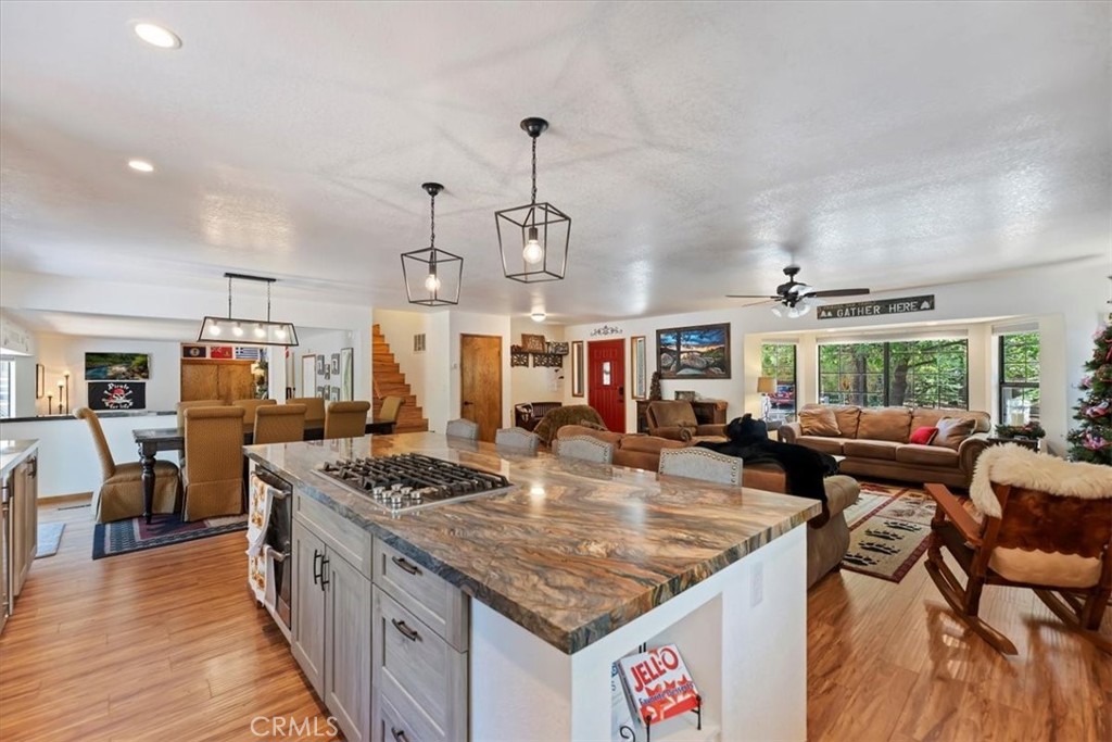 Totally gorgeous remodeled home features an awesome high end kitchen, large kitchen island with bar stools, immense greatroom with beautiful furniture and fireplace also has full dining area with seating for 8, AND a separate game room with wet bar and half bath. All of the living area is open making this a fabulous entertainers' home! Updates are numerous and include newer luxury vinyl plank flooring, newer roof, and custom furnishings that stay! On this amazing main level, prepare to be wowed when you open the front door. Upstairs are 4 beautifully furnished bedrooms, a full guest bathroom and lovely master suite. The exterior offers many amenities including RV or boat parking, front paver patio and covered front porch, rear deck with party spa, gas firepit and seating, additional patio with party lights and backyard if fully fenced! Two spacious sheds provide additional storage but don't forget this home also has a convenient attached 2 car garage! It's the turnkey property that checks all the boxes on picturesque Cascade Road, surrounded by other beautiful homes. Steps to the National Forest for peaceful hiking and minutes to Bear Mountian ski resort, the village and lake. Priced to sell! Come and take a look!