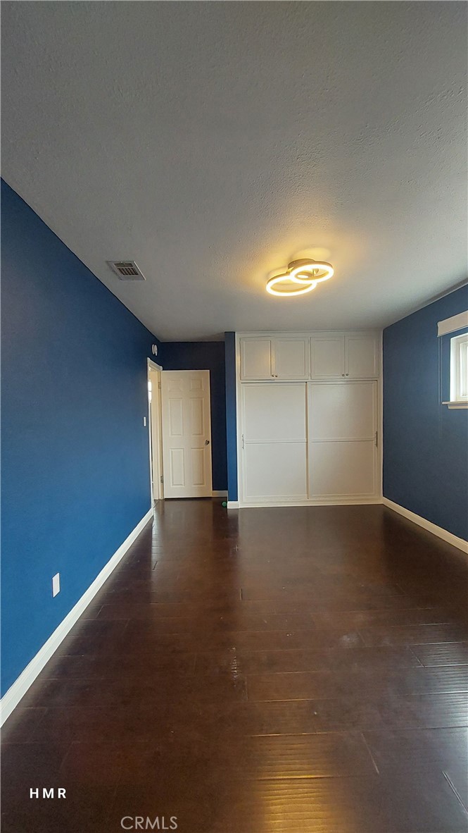This home features 4 bedrooms and 2 baths, both of which have been upgraded. Great wood floors run throughout. The windows are plentiful and big, and allow for lots of sunshine and natural lighting. Beautiful white kitchen with quartz countertop, and includes newer stainless steel appliances. There is an indoor laundry room. The backyard is huge and is ready for year-round BBQs and gatherings