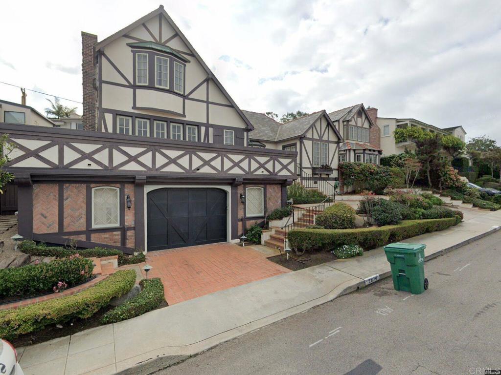 Prime La Jolla Shores location. Remodel, Reimagine, or Rebuild this rare English Tudor-style home. First time on the market in 30 years, this unique property offers 5 bedrooms, 5 baths, and 4,268+ sq ft of living space on a 7,044 sq ft lot with ocean view potential. Architectural details reflect a blend of late 1920s-early 1930s design, possibly influenced by Tom Grunow, Drew Patterson & Tony of ‘Island Architects.’ Interiors feature custom details by renowned designer Constance Noah, known for her faux finishes and European-inspired aesthetic. Remodeled circa 1980–1982. Located on a quiet, coveted street just steps from La Jolla Shores Beach, the La Jolla Beach & Tennis Club, and the Village’s shops and dining. Zoned for single-family use with flexible building options. An exceptional opportunity to create your legacy in one of Southern California’s most desirable coastal neighborhoods.