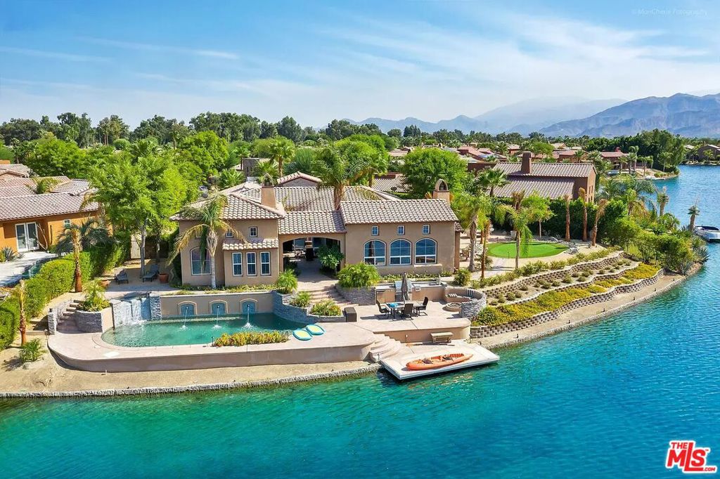 STUNNING DESERT LAKE-FRONT RETREAT!!!   Welcome to 14 Via Santa Velera, a beautifully appointed home located in the prestigious gated lake community of Santo Tomas on the Lake in the heart of Rancho Mirage.  This 4 bedroom, 4.5 bathroom, 3,350 sqft home sits on a massive 17,860 sqft lot and offers the perfect blend of contemporary comfort and desert elegance, ideal for seasonal or long-term stays.  Step inside to an open-concept floor plan with high ceilings, abundant natural light, and seamless indoor-outdoor living.  The gourmet kitchen features upgraded appliances, granite countertops, a spacious island, and ample storage - perfect for entertaining or casual meals at home.  The primary suite is a private sanctuary with a spa-like en-suite bathroom, walk-in closet, and direct access to the backyard.  Enjoy panoramic 270 degree lake and mountain views, along with the pool, hot tub, built-in BBQ station, fire pit, patio areas, pool table, and putting green - creating a resort-style ambiance in your own backyard.  Walk down to the private dock and cruise on the lake with the 16' electric boat or use the kayaks for a relaxing evening on the lake.  (Boat not pictured).  Includes a social and sports membership to the Mission Hills Country Club (pool, tennis, fitness, croquet, pickleball, restaurant).  Enjoy desert living at its finest!  Available November 1, 2025 for seasonal rental.  Long term tenants also welcome at a discounted rate.  Tenant pays for electricity and gas with $500 monthly credit for each.