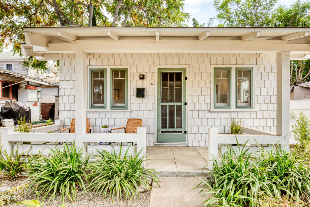 Welcome to 100 Palmetto Drive #6 - a timeless Craftsman cottage in the heart of Pasadena! Located in the historic Palmetto Court, just moments from Old Town Pasadena, this beautifully restored 1915 cottage combines classic architectural charm with thoughtful modern updates.The kitchen has been tastefully refreshed with newer cabinetry, countertops, appliances, and lighting, offering both function and style. The remodeled bathroom features updated fixtures, a frameless glass shower partition, newer flooring, and a clean, modern look that complements the home's vintage character.Throughout the cottage, you'll find abundant natural light, original built-in cabinetry, refinished hardwood floors, and a decorative brick fireplace that serves as a warm focal point in the living room. The home is equipped with a portable air conditioning unit and ceiling fans in both the living and bedroom for year-round comfort. A full-size washer and dryer are conveniently located in the covered side patio area.Enjoy your mornings or evenings on the welcoming front porch, surrounded by the charm and history of one of Pasadena's most beloved bungalow courts. The property also includes one uncovered parking space and three guest spaces for added convenience.Centrally located near shops, dining, public transportation, and freeway access, this home offers the perfect balance of privacy, character, and convenience. An ideal alternative to condo or apartment living--this special cottage offers the warmth of history with the ease of modern living.