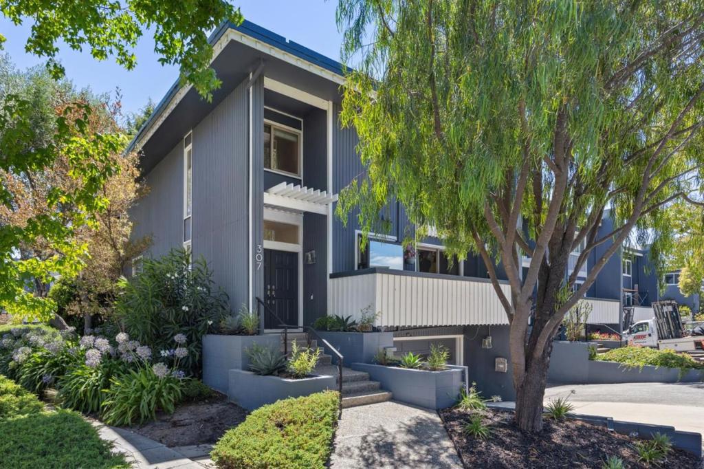 Welcome to your new home at 307 Carlos Ave, a rare end-unit offering sophisticated spaces, comfort, and privacy of a single-family residence. Thoughtfully designed across approximately 1,900 square feet, this 3-bedroom, 2.5-bath home showcases bright, open living spaces, natural light, and seamless indoor-outdoor flow with two balconies and a generous-sized patio. Recently refreshed with high-end finishes throughout, this home features a spacious living room with oversized windows, a striking fireplace, and access to the private outdoor space. The beautifully updated kitchen is both functional and stylish, flowing into an inviting dining area ideal for everyday living and entertaining. Enjoy warm days by the community pool and peaceful evenings on your serene patio. Additional highlights include an oversized two-car garage with built-in storage, in-unit washer and dryer and direct interior access for added convenience. Perfectly situated on the border of prestigious Atherton and just minutes from downtown Redwood City, Menlo Park, Stanford University, and major commute corridors, this turnkey townhome blends elegant style with unbeatable access to the best of the Peninsula.