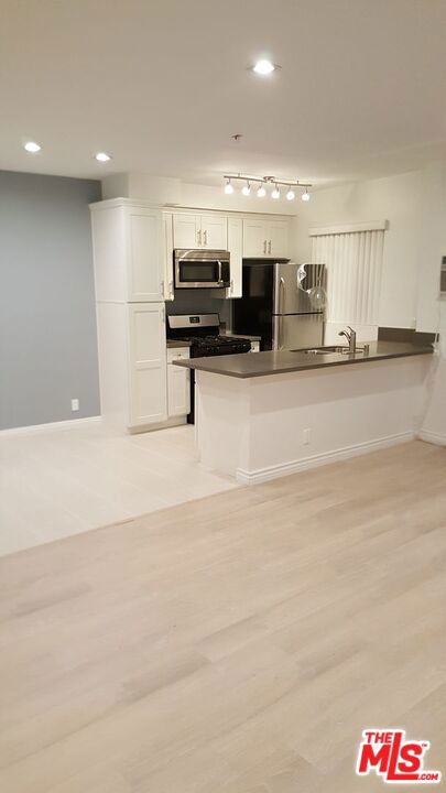 LARGE. Updated. Top Floor. 1 Bed + 1 BathCOMPLETELY UPDATED UNITUpdated kitchen cabinets with stainless steel refrigerator, stove, microwave, and dishwasher.The kitchen has white tile and the rest of the unit has laminated hardwood floors.Bedroom and Living room has new AC installed,The bathroom has all new cabinets and tiles all overOther amenities include a huge balcony, lots of closet space, recess lighting, assigned parking spot, brand new washer and dryer in the building,Please contact us to schedule a showingsqft are estimated