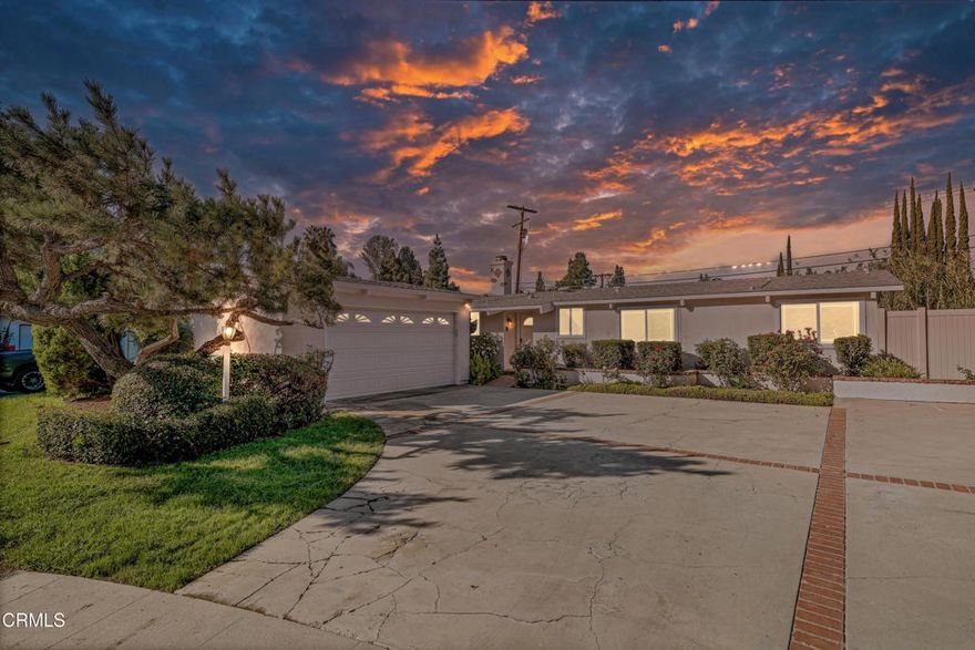 Nestled on a peaceful flat cul-de-sac south of Ventura Boulevard, this mid-century modern retreat with a pool, blends indoor/outdoor living, energy efficiency, and a coveted Woodland Hills lifestyle. The open floor plan showcases exposed wood beam ceilings, airy volumes, and a seamless connection to the outdoors through multiple sliding glass doors leading to the pool, multiple patios, and private yard, creating the ideal setting for relaxed living and effortless entertaining. The kitchen, living, and dining areas flow seamlessly, oriented toward the sparkling pool and side dining patio for year-round enjoyment of California's indoor-outdoor lifestyle. Owned and paid-off solar panels (installed 2022), a newer roof (2022), EV charger, tankless water heater (2024), newer HVAC system (2022), upgraded insulation and ducting, 200-amp panel, and updated plumbing and windows provide modern efficiency and peace of mind while preserving the home's special architectural character. Featuring 4 bedrooms and 1.75 baths, including a spa-like remodeled Jack & Jill marble tile finished bath, the home offers flexible living spaces ideal for today's lifestyle needs whether it be creative workspace, a wellness room, or guest accommodations. Multiple access points to the yard and pool from the main living areas and bedrooms enhance the home's resort-style feel. Conveniently located near Woodland Hills' favorite local hotspots, it is minutes to Bristol Farms, Starbucks, Handel's Ice Cream, boutique fitness studios, and both trendy and legendary dining spots along Ventura Boulevard. The Commons at Calabasas, multiple shopping destinations, hiking trails, and weekend farmers' markets are all nearby, providing an array of lifestyle amenities just moments from home. Situated on an 8,646 sq ft lot, and first time on the market in nearly 30 years, this is a rare opportunity to own a pool home with architectural charm, energy-smart features, and a quiet, tucked-away setting close to everything that makes Woodland Hills one of the most desirable communities in the Valley.