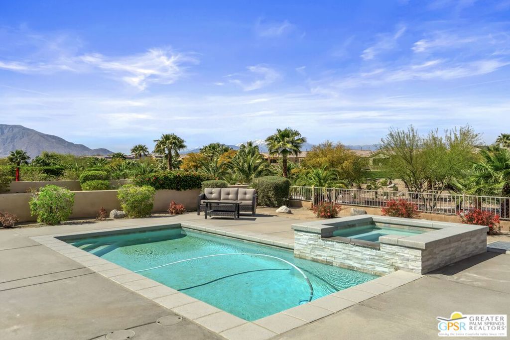 Desert Homes Realty presents resort living in the prestigious Desert Princess Palm Springs Resort in Cathedral City, where YOU OWN THE LAND!! At 2,100 sq ft with 10" ceilings, this is the largest floor plan in the Arroyos neighborhood of Desert Princess Country Club. The large kitchen has an island with incredible quartz countertops with a bar height counter that can be used as a breakfast bar or a social gathering with friends. The appliances are all high-end, including a gas cooktop, electric oven, microwave, garbage disposal. There's a large sliding glass door from both the living room and another in the dining room leading out to your own private pool, spa and built in BBQ entertainment area. The backyard area has Panoramic Mountain Views and connects to the fully landscaped arroyos with almost 4 miles of walking paths; enhancing your enjoyment, exercise, views, and privacy. Features like custom cabinetry, tiled floors through out & modern interior lights throughout to complete this contemporary home. This modern, highly customized 3-bedroom home has ensuite bathrooms and walk-in closets in each bedroom. Each shower was designed with custom tiles and hardware. An additional half bath ensures that your guests feel welcomed and pampered. The home includes an inside laundry room, tankless hot water heater, wall remote-controlled fireplace, large garage with a separate area to park your golf cart inside. The price comes furnished with Ethan Allen furniture. This home offers elegance and leisure as a primary home, or secondary home that can be offered as a short-term rental. HOA DUES INCLUDE: Cable TV with two movie channels and 2 DVR/HD Spectrum Cable boxes, as well as High Speed Internet. Access to an impressive array of amenities in this gated community, including: 35 community pools/spas; including 2 lap pools, 24-hour security guard at the front gate, membership to Health and Fitness Center, Tennis, Bocce ball and Pickle ball courts, and discounts at the clubhouse grill dining room, masters lounge, pro shop, and locker rooms with preferred tee times at the golf club. The Desert Princess has an affordable 27-hole PGA Championship golf course, no Tee-time lotteries, no initiation fees, rated among the best in the valley by GOLF DIGEST. Your HOA Fees also provide maintenance of your front and back yards by HOA ground crews, outside pest control when requested, outside landscape water, (you pay only for inside water).