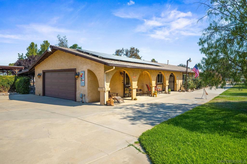 Welcome to your private retreat in the heart of Ramona! This charming single-level home sits on a sprawling, flat acre lot—perfect for all your outdoor hobbies, entertaining, and future possibilities. With a newer roof and a large, paid-off solar system, this property combines peace of mind with energy efficiency. Step outside and discover the ultimate indoor/outdoor lifestyle. Enjoy a California room complete with pool table and bar area, plus a spacious covered patio, outdoor kitchen, and cozy fire pit—ideal for hosting gatherings year-round. Car and RV enthusiasts will love the covered RV parking and multiple storage sheds, providing endless space for toys, tools, and projects. Whether you’re relaxing with friends, entertaining family, or simply soaking in the Ramona lifestyle, this property delivers it all. Don’t miss this rare opportunity to own a versatile home with room to grow!