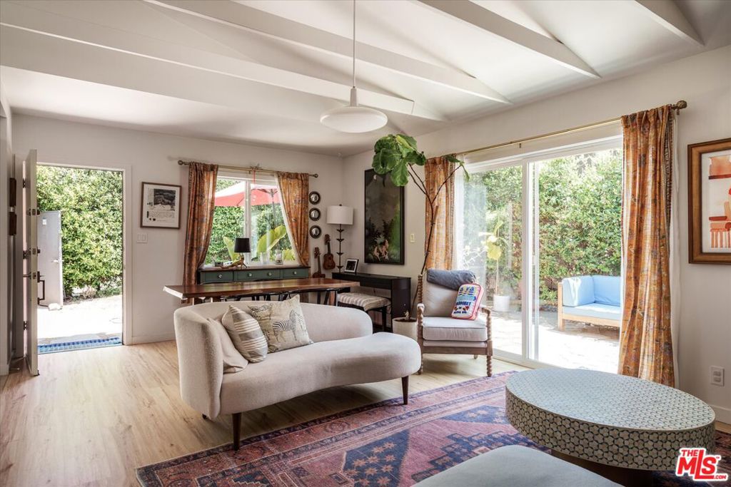 Nestled at the end of a peaceful cul de sac in a lovely corner of Atwater Village, this gated duplex with permitted ADU, with a total of 3 units, is an investors dream - or perfect for an owner/user who is looking for the feeling of a private home with income potential. The front unit has 2 bedrooms, 1 bath with an additional attached studio/den space, an enclosed private garden and direct access to a 2 car garage. Down a garden path you will find another 2 bedroom, 1 bath unit with beamed ceilings, great light and an ample grassy yard that envelops the house, making it feel like a single family residence. On the rear of the property, there is a one bedroom, 1 bath prefab ADU, with small private garden space, and potential to build a gate directly to access the LA River bike path. This is a cash flow positive building, delivered fully occupied, with reliable tenants paying market rent. Two main units are on month to month leases, ADU is leased through August 31, 2025. Property available for viewing at brokers open house. After such time, the property will be shown to buyers upon accepted offer only. Seller can provide pre-inspection reports and disclosures upon request. Sale includes 3794, 3794 1/2, 3794 3/4 Legion Lane. Do not disturb tenants.