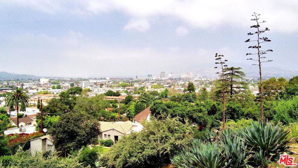 This residential hillside lot, nestled in the vibrant heart of Glendale, boasts breathtaking city and mountain vistas amidst lush greenery. The terrain features a mix of steep and gentle slopes, with a level area situated between Cypress Street and Alta Vista Drive. All essential utilities are readily accessible at the street. Located in proximity to Forest Lawn Memorial Park, the Glendale Galleria, Americana, as well as a plethora of dining options, shops, recreational spots, and parks, this lot promises a blend of tranquility and convenience. 6,179 SF approx., it lies adjacent to opulent multi-million-dollar residences and offers seamless connectivity to major freeways including the Glendale (2), the Golden State (5), and the (134) on its northern boundary.