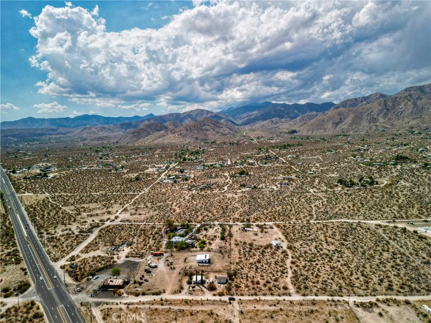 Discover the possibilities with this 8.85-acre property in Morongo Valley (APN: 0584-282-06-0000). The parcel boasts sweeping desert and mountain views, including Mt. San Jacinto, and is located just off Highway 62 for quick access to nearby destinations—only 20 minutes to Joshua Tree, Yucca Valley, Palm Springs, and Desert Hot Springs.

The property features a unique dual zoning designation: the eastern section is zoned CN (Neighborhood Commercial) and the western section RL (Rural Living). This combination provides a wide range of potential uses, from residential development to commercial projects.

With its prime location, mixed-use potential, and spacious acreage, this property offers the perfect opportunity for building, investment, or future growth. Buyer to verify all aspects including zoning, utilities, and intended land use with San Bernardino County.