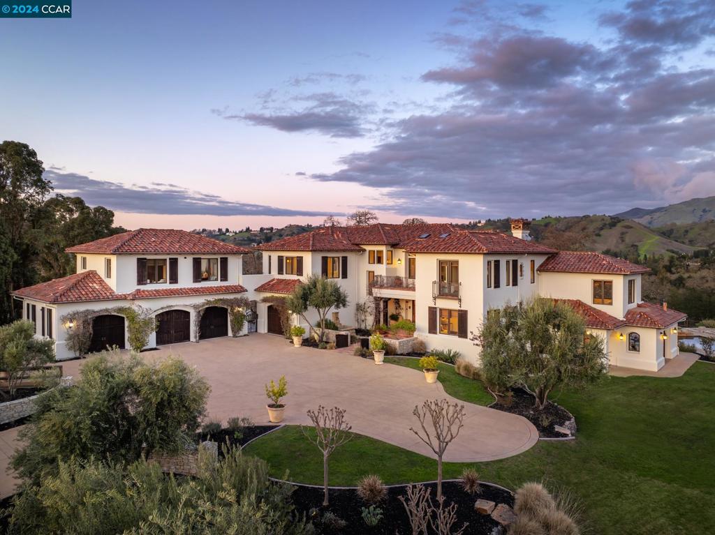 Gated, knoll-top 360° view property, two miles from downtown Danville. Close to 12 years of award-winning schools and less than 30 miles from SF and the Silicon Valley. This Kubitschek-designed Napa style home is situated on a spectacular 3 acre parcel unlike anything ever offered for sale in Danville.Custom built to the highest degree of quality, with exposed wood beam ceilings, radius-cornered walls, fabulous walnut and terra cotta tile floors, and gorgeous views from every window. Expansive grassy areas and stone paths lead to a barn, riding arena and horse turnouts with direct access to the Mt. Diablo trail. A 630sf one bedroom in-law unit is just 1 of 1000 reasons to visit this beautiful property that transcends all expectations. Main house: 9076sf 5 beds/2 offices/gym/2 bonus rooms/wine room/5 baths/2 half baths/east and west facing balconies In law: 630sf 1 bed/1 bath/kitchen/living area Barn: 1432sf