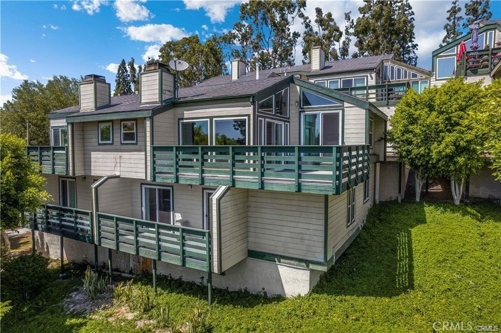 Absolutely stunning views! This beautiful home gives you the feeling that you're on vacation. Floor to ceiling windows invite the beautiful sunlight and panoramic views of Anaheim Hills. This two-level townhome features the main living space on the second level (entry of home is on 2nd level) with the bedrooms downstairs. Features of the main level include an ample sized kitchen with breakfast nook and plenty of storage space, spacious formal dining area, extra-large living room with fireplace, half bath for guests, and multiple outdoor private balconies. The private principal suite includes a walk-in closet and adjacent balcony with views. Large secondary bedroom also has it's own balcony space. Laundry room and 2nd full bath located downstairs as well. Very private with only one common wall and spacious 2-car garage just steps away from your front door. Association pool very close by and plenty of guest parking available. Conveniently located off Lakeview and the 91 freeway - perfect location for commuting to L.A., Orange, or Riverside Counties.