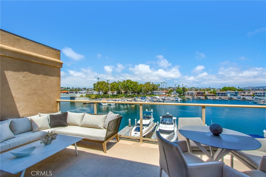 Indulge in the epitome of coastal luxury with this exceptional PENTHOUSE CONDO situated on the bayfront in Newport Beach. Boasting breathtaking views of the harbor, ocean, city lights, surrounding mountains, and Catalina Island, this single-level residence offers a harmonious blend of sophistication and comfort. Recently updated and sharing only one common wall, this exclusive home is a serene retreat with designer enhancements throughout. High-end features include sleek Viking appliances, rich hardwood flooring, and a tastefully remodeled primary bathroom. The open-concept layout showcases seamless flow between the kitchen, dining, and living areas, all thoughtfully positioned to capture uninterrupted views of the sparkling bay, Lido Isle, and beyond. Step outside to the expansive terrace that spans the full width of the residence, providing the perfect vantage point to enjoy the vibrant waterway and passing boats. The private Owner’s Suite, located on the opposite end of the home, features its own balcony with panoramic vistas extending to Catalina Island. A secondary en-suite bedroom and a flexible den/office space, which could serve as a third bedroom, complete the thoughtfully designed floorplan. Wake up each day to tranquil water views and gentle ocean breezes in this prime location. Perfectly positioned across from The Cannery and Blue Water Grill, this property is just a short walk to Lido House, Nobu, and the boutique shops of Newport Beach. Secure gated parking and a semi-private elevator that opens directly to your front door ensure convenience and peace of mind. For boating enthusiasts, the community offers optional rental boat slips, accommodating vessels up to 50 feet, providing direct access to the harbor and open seas. Don’t miss this rare opportunity to enjoy premier bayfront living in one of Newport Beach’s most sought-after locations. Owner may consider a sale. Contact agent for details. Property may be delivered furnished for an additional fee