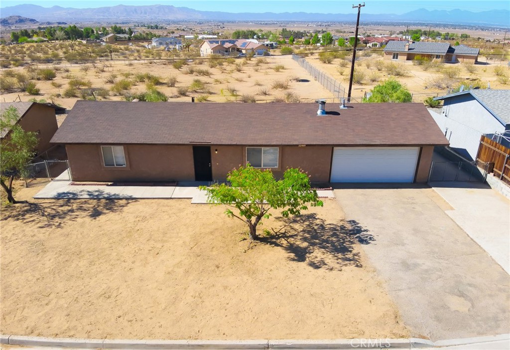 Well-maintained Apple Valley home in James Town Community of Apple Valley - Ready for your touch. The interior boasts an open floor plan, creating a spacious and airy feel. You'll enjoy an eat-in dining area perfect for casual meals. The kitchen provides ample cabinet space, ensuring plenty of storage and efficient meal preparation. Enjoy abundant natural light throughout the home, enhancing its warmth and inviting atmosphere. A cozy fireplace adds charm and a focal point to the living space. Situated on an expansive 8400 sq. ft. lot, the property features a chain-link fence, providing a secure and private outdoor space. A separate dog run and a 2-car attached garage. Come in and make this yours.