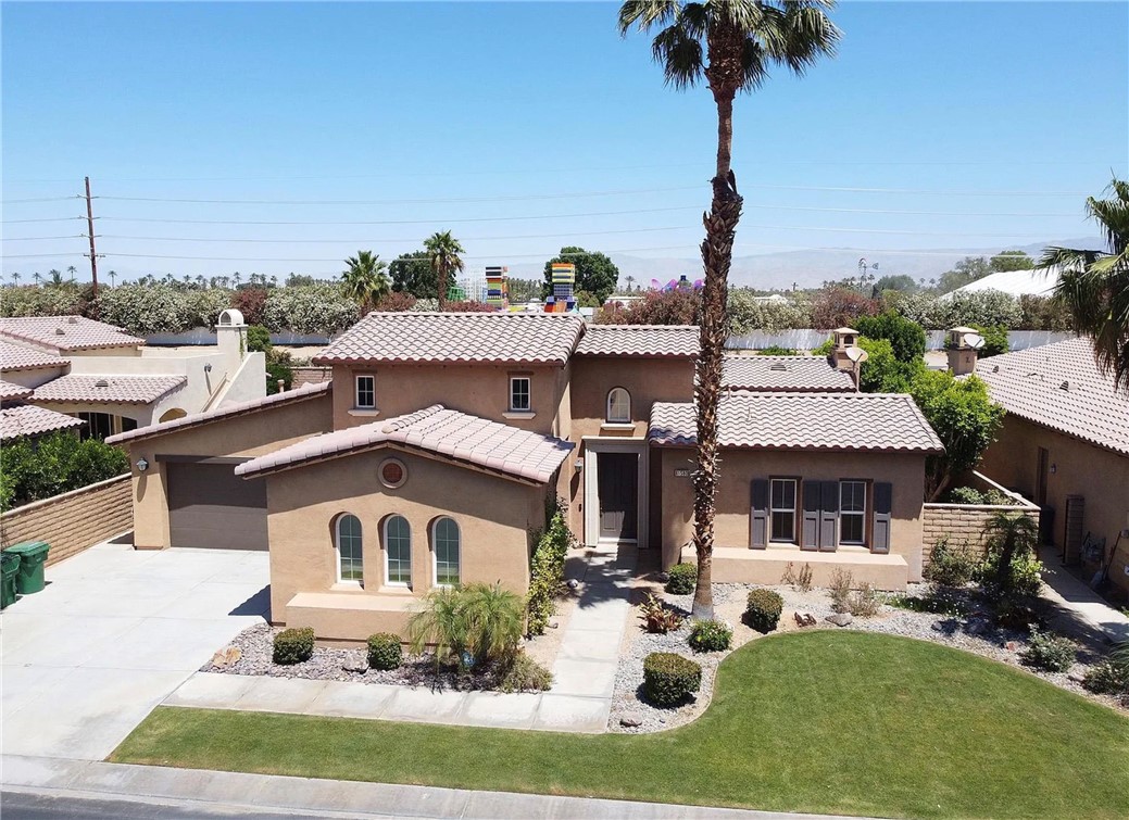 Located in the prestigious gated community of Rancho Santana, this beautifully designed single-story home offers 2,782 sq. ft. of spacious living.
Featuring three generously sized bedrooms—each with its own en-suite bathroom—this home combines comfort, privacy, and style. The open-concept layout boasts soaring ceilings, elegant tile flooring, and a chef’s kitchen complete with granite countertops, a large center island, walk-in pantry, and stainless steel appliances. The inviting family room includes a cozy fireplace and built-in wet bar—perfect for entertaining. The expansive primary suite is a serene retreat, offering direct backyard access, a walk-in closet, dual vanities, a soaking tub, and a separate shower. A private attached casita (the third bedroom) with its own entrance and en-suite bath adds ideal space for guests or a home office. Enjoy outdoor living with a peaceful interior courtyard and a covered back patio, all complemented by an attached three-car garage with room for a golf cart. Additional highlights include an in-home laundry room and access to community amenities such as scenic walking trails, a neighborhood park, and a putting green.
Just minutes from PGA West, Old Town La Quinta, the Polo Fields, and the Indian Wells Tennis Garden—this home offers the perfect blend of luxury and location.