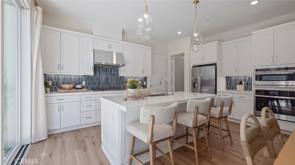 This new two-story townhome is host to an inviting open floorplan on the first floor, combining to the kitchen, living and dining areas to simplify everyday multitasking and entertaining. Upstairs, three bedrooms surround a versatile loft, including the luxurious owner’s suite at the front of the home with direct access to a walk-in closet and spa-inspired bathroom. Portia is a collection of new attached and detached homes in Luna Park, now selling at Great Park Neighborhoods in Irvine, CA. The community features fantastic amenities, including a sparkling swimming pool, multi-use trails, a clubhouse and more to encourage active living. Residents enjoy access to award-winning schools in the Saddleback Valley School District and proximity to the 5 and 405 freeways, making commutes and everyday travel simple. The best of local shopping, dining and entertainment is a short drive away at the Irvine Spectrum Center.