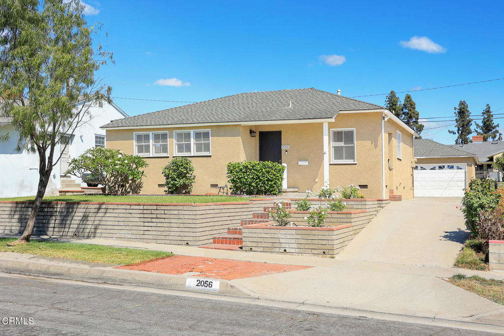 Welcome to this charming Monterey Park residence, boasting impressive curb appeal and a unique distinction of having been lovingly maintained by its original owner since 1951. This home features a highly desirable floor plan that includes three bedrooms and two bathrooms within 1,319 square feet of living space. Upon entering, you'll immediately notice the bright, inviting rooms with original hardwood floors, freshly painted walls, and new light fixtures throughout most rooms. Additionally, this home includes a versatile 362 square foot (measured) workshop, a 358 square foot (measured) garage and a long concrete driveway leading to a relaxing backyard with a large covered patio and gardening space. Situated in a sought-after neighborhood, this home provides convenient access to major freeways, Bella Verde Golf Club, TopGolf, and the vibrant dining and shopping options at Montebello Town Center.