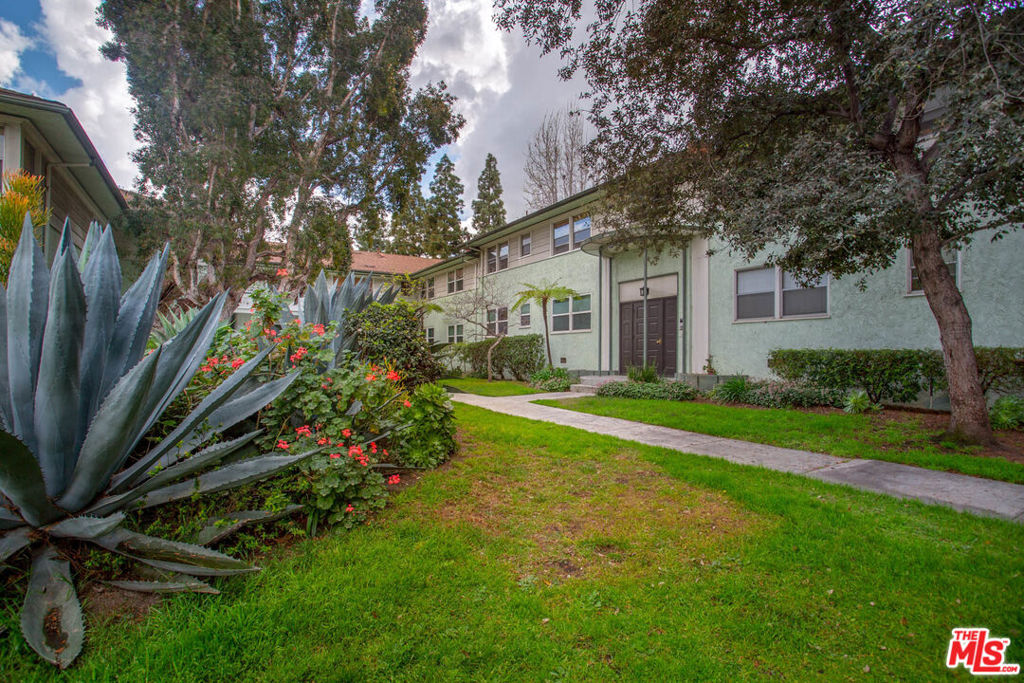 Top floor unit boasting with tons of natural light in a wonderful community is now available! This unit has refinished hardwood floors throughout and newer high-efficiency windows. The kitchen is equipped with appliances and lots of storage space. You'll love the peek-a-boo view of the Hollywood Hills from the living room. There is a dining area, two spacious bedrooms with generous closet space, and one and a half bathrooms. Step out through the convenient back door off of the kitchen that leads to a private garage. The grounds are lush and filled with mature trees. Community is guard gated and has a beautiful pool and spa. Community is right on the edge of Culver City, across the street from Target and walking distance to the Expo Line.