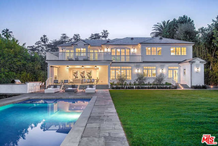 Located in prestigious Brentwood Park, this magnificent newly built estate features the highest caliber of finishes, ample grounds and grand-scale living spaces that distinguish it among the neighborhood's finest homes. Beyond a secure, fully-hedged motor court, doors open to a soaring 22-foot high foyer, leading to a living room with a fireplace, wood-paneled study and formal dining room with butler's pantry to a phenomenal open chef's kitchen and great room with a bar, fireplace & sliding pocket doors to the grounds beyond. Upstairs holds a living area, 5 ensuite bedrooms with walk-in closets, including a gorgeous master with fireplace, extra-large private balcony, exquisite dual baths & showroom closets. An expansive lower level holds 2 ensuite bedrooms, a theatre, gym, playroom, wine room & entertainer's dream bar. An incredible backyard features a heated loggia with fireplace, pool, spa and sprawling lawn. An elevator, Crestron system and 3-car auto gallery complete the offering.