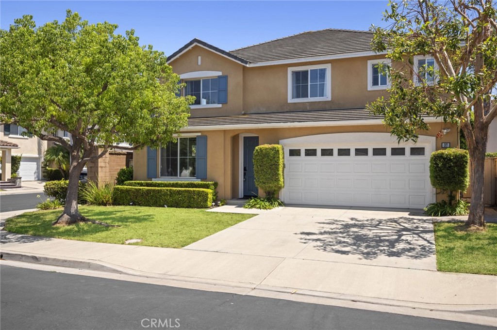 Step into effortless style and turnkey elegance in this fully remodeled four-bedroom home, ideally located on a corner lot behind the gates of Oak Creek - one of Irvine’s most sought-after and well-connected communities. Flooded with natural light, the home has been thoughtfully redesigned with a modern, elevated aesthetic. Wide-plank flooring, fresh neutral tones, and custom lighting set the stage for refined everyday living. The heart of the home is the expansive chef’s kitchen, complete with waterfall-edge quartz countertops, sleek cabinetry, and a large center island with bar seating - a perfect gathering space for family and guests alike. The open-concept layout flows seamlessly into airy living and dining areas, while sliding doors open to a private backyard ideal for al fresco dining or quiet morning coffee. Upstairs, four spacious bedrooms and beautifully updated bathrooms offer comfort and style, including a luxurious primary suite featuring a spa-inspired bath with a stand-alone tub and generous walk-in closet. Every detail throughout the home from the finishes to the fixtures has been curated to reflect a sense of calm, modern luxury. Set on a quiet, tree-lined street, this home also grants access to Oak Creek’s impressive amenities, including pools, parks, tennis courts, and top-rated Irvine schools. With nearby shopping, dining, and easy commuter access, this is a home that blends peace, connection, and the very best of the Irvine lifestyle.