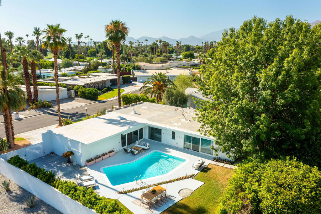 The stars have aligned and right now, Hollywood and mid-century modern history have created an extraordinary opportunity in Rancho Mirage's coveted Tamarisk neighborhood. It's called Green Acres, designed in the late 1950s by Robert Marx, son of Gummo Marx, this home is a rare find that was recently celebrated in the book ''Mod Mirage'' for its architectural significance. The window of opportunity is open. This spectacular home features dual primary suites; both with luxurious spa-like bathrooms. One additional guest room with sliders to pool and gardens beyond. The home's walls of glass seamlessly connect the interior to an exquisitely landscaped backyard with a sparkling swimming pool and breathtaking west-facing views of the mountains. The centerpiece is the original floating lava rock fireplace. Benefiting from recent upgrades, including a newer roof, updated electrical and plumbing systems, and a state-of-the-art saltwater pool with WiFi control, this home is updated for modern living. The peaceful cul-de-sac setting further enhance its appeal, no homeowner's association all present a unique opportunity to blend historical charm with contemporary amenities. Exceptional offering.