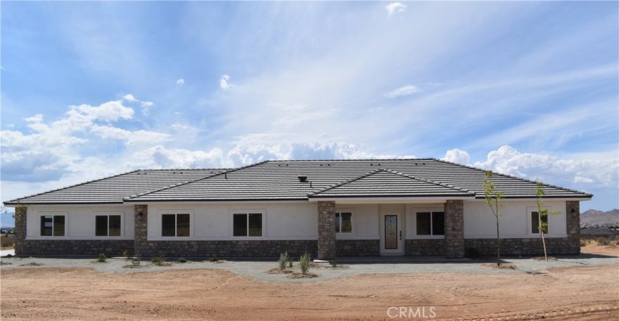 Beautiful new build on Pauhaska Road in Apple Valley, California.  The view lot features 2-1/2 acres.  The home is 2095 square feet. There are 4 bedrooms, one master bathroom with a freestanding tub, and one additional bathroom.  The home has 9-foot ceilings, is sheer paneled and earthquake proof.  The kitchen includes a pantry and a Kitchenaid dishwasher.  There is propane subbed outside, and a BBQ platform.  It also contains subbed out features for electrical in the back yard for lighting.  There is a 3-car garage with insulated doors and an oversized solar system.  The seller will set the meter and pull power on or about October 20-30, 2025.