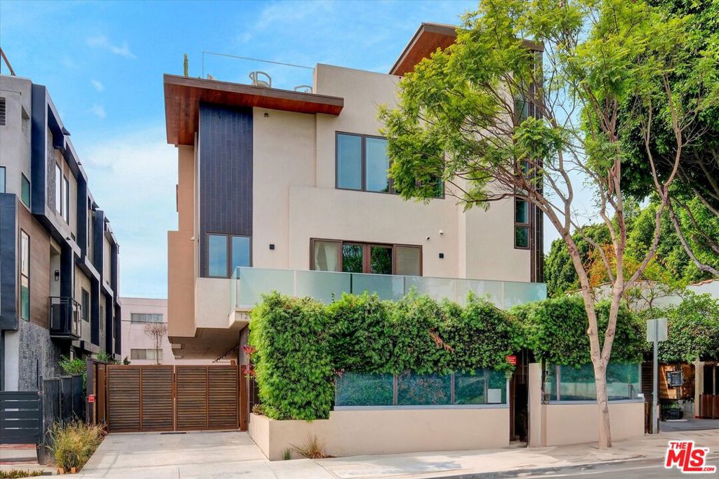 Welcome to 1249 North Formosa Ave, A 3-story townhouse with panoramic views of West Hollywood, a breathtaking background of The Hollywood Hills and Downtown Los Angeles. This modern, front facing unit, is part of a private 5-unit building built in 2017. With its own private entrance, detached from the rest of the building, you are invited in by lush greenery and an outdoor courtyard secured with electronic access. The main level boasts 10-feet ceilings, floor-to-ceiling windows and custom cabinetry that compliments a chef's kitchen with plenty of storage space. This open concept offers al-fresco dining as the living room extends itself to an outdoor balcony, drenched in California sunshine. The primary bedroom, located on the 3rd floor offers noise cancelling windows, insulated with a double pane and an expansive walk-in closet. The second bedroom offers a stunning view of the outdoor courtyard, which can be used as an office, studio or gym. Finally, the sun deck provides an unparalleled experience that is an entertainer's paradise, complete with a barbecue pit, miniature fridge and sink. Modern luxury meets iconic views in this West Hollywood condominium! Seller offering a limited-time financing incentive: 3/2/1 rate buydown! Enjoy lower monthly payments for the first three years (subject to lender approval & buyer qualification).