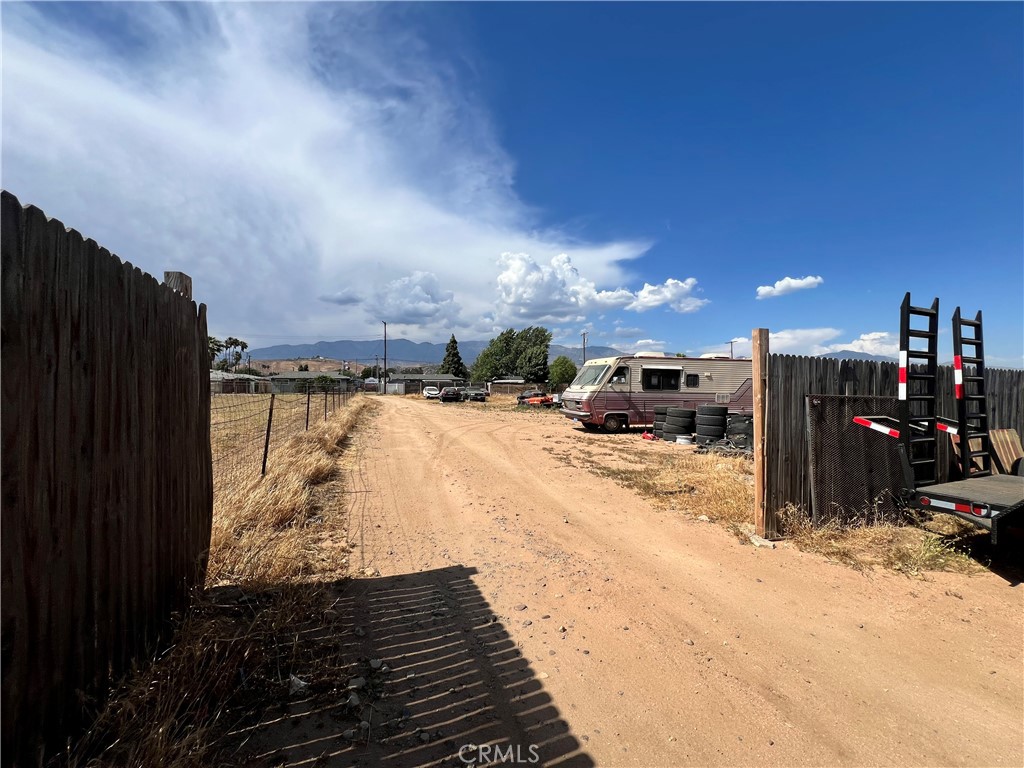Over 30,000 Sq Ft Flat Lot in the City of Banning - Horse Property with Mountain Views. This spacious and usable lot features over 30,000 square feet of flat terrain, ideal for building a custom residential home. Located in the City of Banning, the property currently features horse corrals, newer wood fence, 900 Square feet of covered outdoor living with an expansive 30x30 patio cover. Enjoy beautiful mountain views and peaceful rural surroundings, with access provided through a city easement. A rare opportunity to own land with open skies, utility potential, and room to grow. Owner might Carry back the loan with the right downpayment.