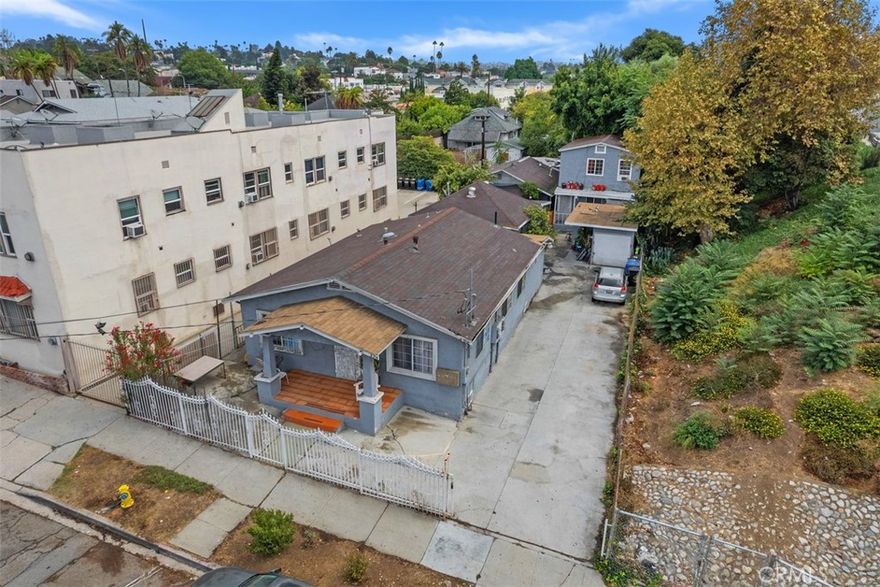 Attention investors & developers! Discover 426 N Virgil Ave, a 5-unit multifamily investment gem located just minutes from Silver Lake, Echo Park, Sunset, Hollywood, and Downtown. Generating strong, consistent cash flow with long-term income stability, this property still holds untapped potential for significant rental upside. Its desirable LAR3 zoning also unlocks redevelopment possibilities for up to 9 units. Spanning 3,427 sq ft on a generous 7,013 sq ft lot, it features a dynamic unit mix (1 x 3BD/2BA, 1 x 2BD/1.5BA, 3 x 1BD/1BA) across four well-maintained buildings, all individually metered for easy management and optimal utility efficiency. Includes 6-car driveway parking, plus a garage for parking or storage. Seize this rare opportunity to own a high-yielding, income-producing asset in a thriving rental market!