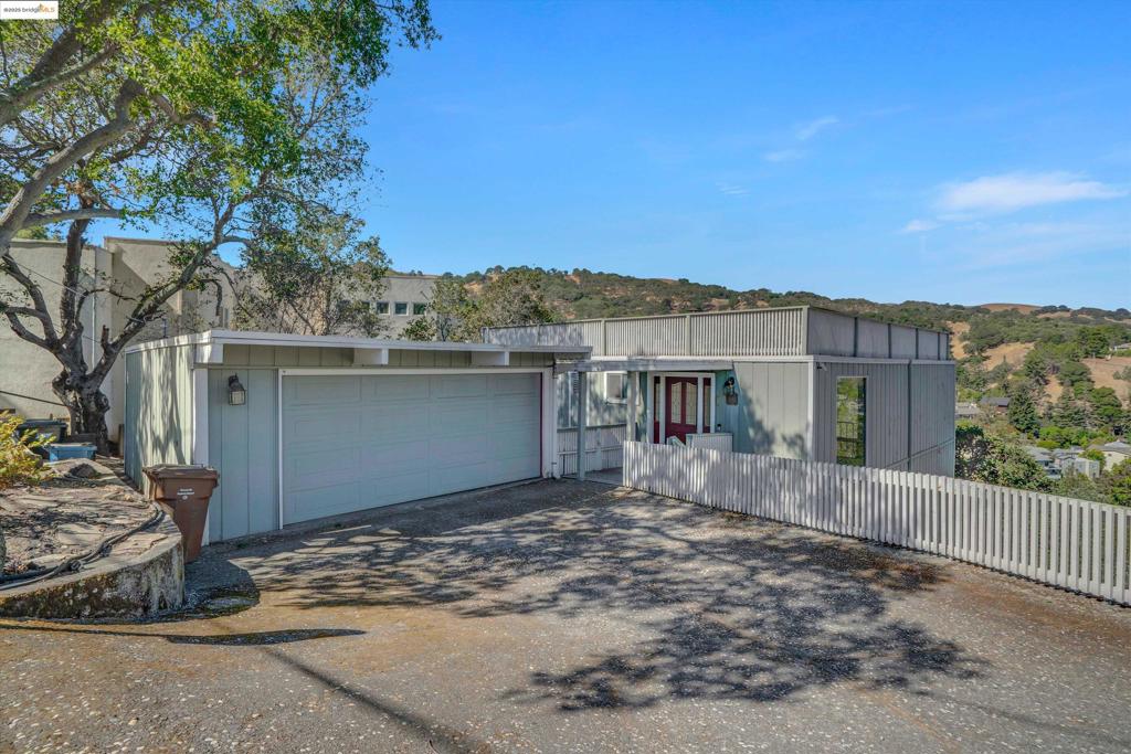 Perched above downtown Martinez, this two-story single-family home offers sweeping views of the water and valley, with a unique opportunity to create your dream space. With 1,718 sq ft of living area on a 7,446 sq ft lot, the home features 1 bedroom, 1.5 bathrooms, and a spacious 2-car garage. Inside, enjoy generously sized rooms, an abundance of natural light, and a flexible layout with tons of potential. The elevated position provides added privacy and a peaceful perch overlooking the Carquinez Strait. Whether you're looking to renovate, expand, or invest, this property presents a rare chance to add value in a well-connected location. Conveniently close to the shops and restaurants of downtown Martinez, public transportation, and major freeways, this home is perfect for buyers with vision and creativity. Bring your contractor and your imagination—and make this hillside gem your own.