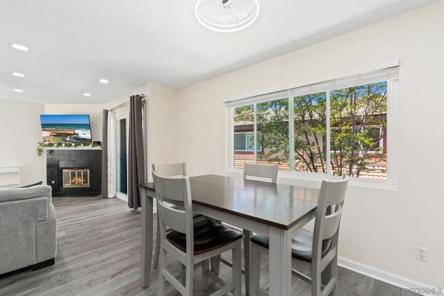 Welcome to the largest 2-bedroom floor-plan in the community—a rare split-level townhome offering both space and style. The airy upper level is perfect for entertaining, with an open-concept layout, luxury vinyl plank flooring, and a private balcony that invites indoor-outdoor living. Downstairs, both bedrooms are very generously sized and thoughtfully positioned to stay naturally cooler, offering more comfortable sleep and lower A/C bills. Enjoy the convenience of in-unit laundry, an attached garage, a community swimming pool, and a location that can’t be beat—close to shopping, dining, parks, and freeway access. A standout opportunity in one of East County’s most desirable communities!