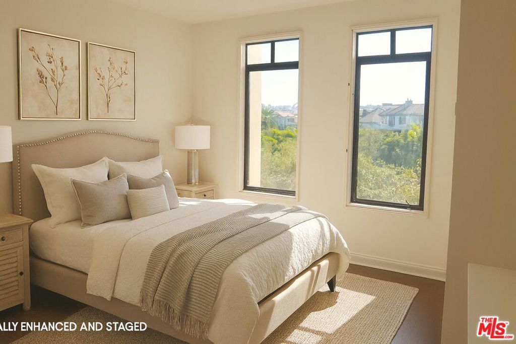 Water Fountain Views + Serene Sounds at this bright and airy 2-Story Metro Condo! Sophisticated charm and tons of natural light exude in this spacious and beautifully maintained 2-bedroom, plus flex space den/home office, 2.5-bath residence located in the heart of Silicon Beach within Playa Vista's highly sought-after Metro Building. This front-facing unit features two side-by-side parking spaces and offers a versatile floor plan. The first level includes a flexible space ideal for a guest bedroom or home office. Upstairs, the primary suite provides a peaceful retreat with a spa-inspired bathroom featuring a soaking tub, separate walk-in shower, dual vanities, and two closets. The second en-suite bedroom enjoys tranquil tree-top views and the soothing sounds of the nearby water fountain.Additional highlights include secure mail and package delivery in a locked mailroom. HOA dues include water, trash, and access to Playa Vista's premier amenitiesThe Resort and CenterPointe Club fitness centers, pools, and spas.Experience the best of urban living in Playa Vista with unmatched access to Silicon Beach's vibrant energy, shops, dining, and entertainment.Photos are virtually staged and enhanced. Buyer to verify all information to their satisfaction.