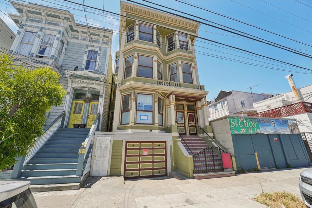 Discover the perfect synthesis of classic San Francisco charm and modern luxury at 1212 Alabama Street. This beautifully renovated Edwardian flat offers a rare combination of space, light, and an unbeatable location in the city's most vibrant and sun-kissed neighborhood. Step inside and be captivated by the inviting floor plan, defined by gleaming hardwood floors and graceful period details. The heart of this home is a luminous living space that flows effortlessly, creating an ideal setting for both relaxation and entertaining. Three generously-sized bedrooms offer tranquil retreats, providing ample space for family, guests, or a dedicated home office. The home features one full and one half bath, both tastefully updated to blend contemporary style with timeless design. Your private urban oasis awaits. Step directly from your home onto an expansive, sunny decka true outdoor living room perfect for morning coffee, al fresco dining with friends, or simply soaking in the Mission's famed microclimate. A versatile bonus laundry/sunroom adds wonderful flexibility, serving as a bright and cheerful space for chores, a creative studio, or a cozy reading nook. Functionality is paramount, with a rare and coveted amenity: an extra-large garage providing secure parking and a storage room.