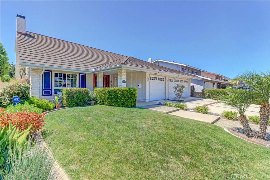 Beautifully remodeled four bedroom two bath home with a three car garage in the highly sought after Westhaven community which offers top rated schools and is located in a great area of Westminster right on the border of Fountain Valley and near Mile Square Park, freeways, shopping, restaurants and entertainment. This home has fantastic curb appeal, a great floor plan (including a bedroom downstairs) and lots of upgrades!! Original owner! A soaring two-story entry greets you and invites you into the spacious living room which has a cheerful front facing window and charming fireplace - cozy nights in anyone? The kitchen is gorgeous! It has high end stainless appliances, double oven, custom soft close white cabinets, lovely contrasting Quartz counters, under cabinet lighting, a separate expansive pantry, ample storage, and a large kitchen island to gather around. The dining room is open to the kitchen and is huge! High end Andersen French doors open to the lovely backyard, which has a covered patio, multiple seating areas, and fruit trees (apricot and Meyer lemon). Family and guests will enjoy sitting out here! The flexible layout includes a downstairs bedroom, ideal for an office, guests, a nanny, or aging parents and an adjacent full bathroom. Upstairs, all the bedrooms are quite spacious. Both bathrooms in the home are very good sized and have Quartz counters, updated vanities and fixtures, and custom tile work. Additional highlights include a direct-access three-car finished garage with an extra fridge, cement roof, copper plumbing, dual-pane windows, plantation shutters, newer heater/AC unit, recessed lighting, high end wood look tile and LVP flooring. Not only was this home lovingly cared for and maintained, the owners have been part time occupants for the last 24 years! This house has so much to offer—don’t miss this chance to make it yours!