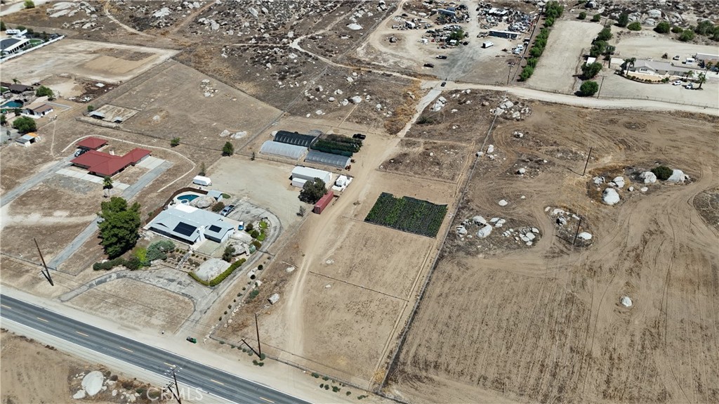 Wow – Nearly 3.5 Acres for Sale in the Heart of Nuevo! Don't miss this rare opportunity to own almost 3.5 acres of versatile land right in the city of Nuevo. Currently operating as a nursery, this property is fully equipped and ready for your agricultural, residential, or investment dreams. Features Include: 3 fully functional greenhouses, Water lines running throughout the property with strong water pressure, Irrigation system set up for both greenhouses and outdoor plants, On-site storage container, Convenient access from both the main road and a back road, Zoning allows for building or placing a manufactured home (permitted), This is a fantastic opportunity for anyone looking to expand their agricultural business, start a new project, or build a custom home in a peaceful yet centrally located area.