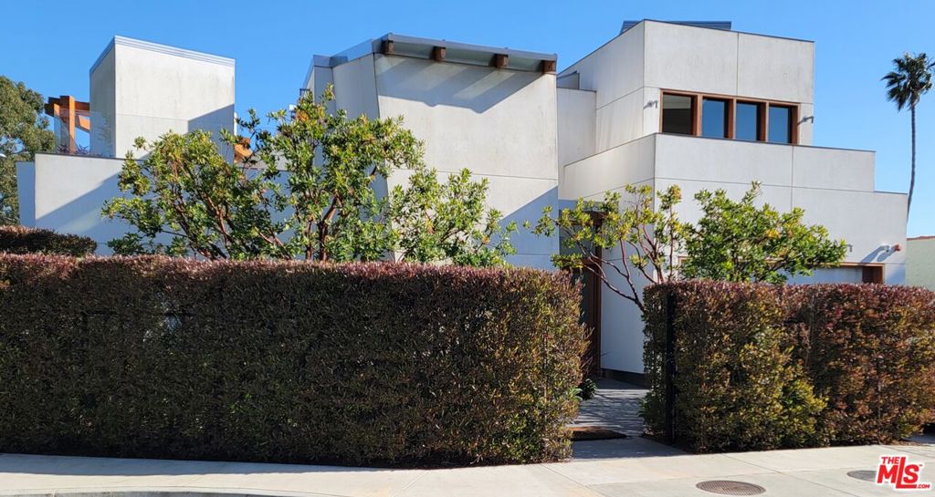 Back on the Market with new pricing. The John Baldessari Gallery Residence, 2018, Frank O. Gehry, CC, FAIA. John Baldessari and Frank Gehry! As impossible to pigeonhole a style of these giants of art and architecture, so it is with their collaboration on John's own home, the model of which was featured center at LACMA's Frank Gehry Retrospective. It's modern, of course, and constructed of the finest materials and accessories available, but in understanding the work, and its success, these terms seem almost irrelevant. It is probably best described in terms of function.Frank and John were friends. From stories about John, one can imagine a request that may have gone like this: Frank, I'm tired of traipsing up and down stairs every time I want something from the kitchen. I want my bedroom to be just steps from everything: my art, my library, the kitchen, and an outdoor place where I can enjoy a cigar, a glass of wine, and a view of the golf course next door. Frank achieved these requirements by pinwheeling the living space and gallery around a cloistered heptagonal courtyard, thus referencing, if not by shape, the program of the early California Missions. Reversing tradition, the master bedroom is on the ground floor, while the guest bedrooms are on the second floor. An elevator contiguous to the master bedroom ascends to the rooftop patios with golf course and city vistas.