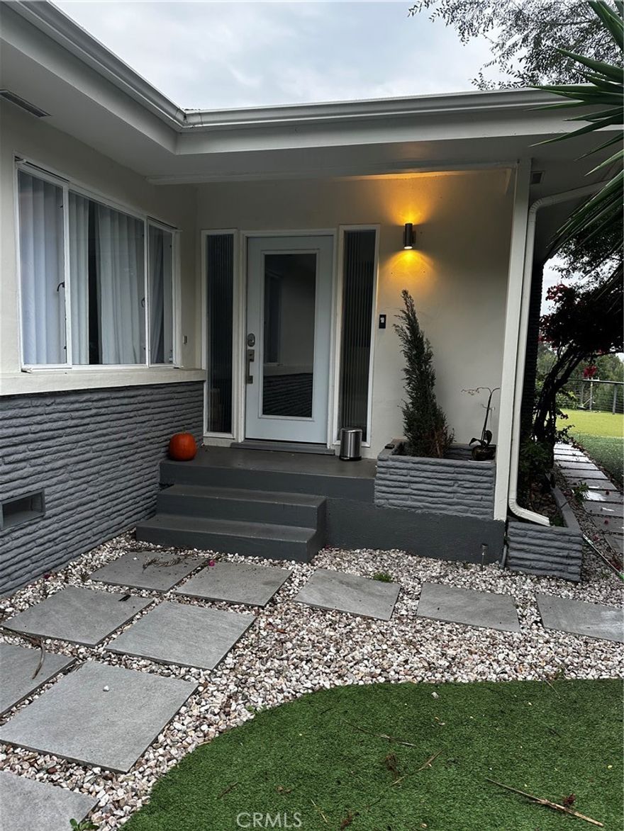 For lease is a secluded single-story hillside residence offering rare privacy and expansive views, located at the end of a quiet cul-de-sac in the desirable Beverly Hills Post Office area. A gated private driveway leads to this approximately 1,700 square foot home set on an oversized lot of roughly 16,000 square feet.

The interior features two bedrooms and two updated bathrooms, wood flooring throughout the main living areas, a formal dining room or den, and a spacious family room with a wood-burning fireplace. The primary suite enjoys tranquil hillside views and a comfortable layout.

Outdoor living is a key highlight, with a wrap-around deck capturing panoramic views from multiple angles, along with additional patio areas and a private spa space ideal for relaxation. The detached garage includes existing plumbing and may offer flexible use options, subject to city verification.

Conveniently located near Beverly Hills, West Hollywood, the Sunset Strip, and the San Fernando Valley, this property offers a unique balance of privacy, space, and accessibility. A rare leasing opportunity in a sought-after hillside setting.