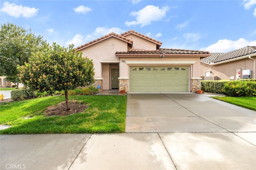 Beautifully updated Capri model home PRICED TO SELL! Located in the vibrant 55+ Gate Guarded Community of the OASIS. Live the Resort lifestyle! This popular plan has 2 large bedrooms PLUS an additional den/office that can easily serve as a 3rd bedroom. The spacious open concept floor plan showcases the newly installed vinyl plank flooring throughout the home. The immaculate kitchen boasts plenty of cabinet space, tile countertop island and natural light from the surrounding windows to enjoy gatherings and entertaining. Connected is the great room complete with cozy fireplace and built in entertainment center. Additional spacious dining room. The fabulous primary bedroom and bath has a custom tile fully remodeled handicap accessible walk in shower. Low maintenance rear yard with covered patio perfect for entertaining guests, BBQs or just enjoying a morning coffee. Two car garage with ample storage space. HOA covers front yard Water & Landscape service and trash service. Just minutes from all shopping/ medical/restaurants & easy freeway access! Right next to Menifee Lakes Golf Course and just a short drive to the Famous Temecula Valley Wine Country. You won't want to miss this adorable home! Call to schedule a private tour today!