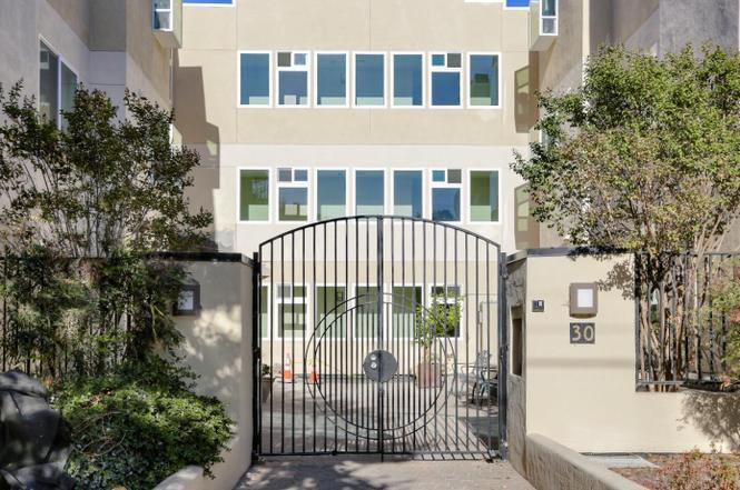 Beautiful downtown Burlingame, sun drenched luxurious 2/2 back end unit is 2 blocks from the AVE. Upgraded unit w/ SS appliances incl Bosch dishwasher, 5 burner gas stove, fridge w/ ice & H2O dispenser, kitchen pantry, tile baths & impeccable interior w/ full size W/ D, greenhouse window, plantation shutters, large master suite w/ sep shower & commode is located in another part of unit to allow for privacy from 2nd bdrm, central air furnace with top of the line purifier. Spotless kitchen flows into spacious dining area that opens into LR w/ tiled fireplace & East facing captivating balcony creates a one of kind entertaining space. Secure entrance, Secure garage parking for 2 cars + big storage. Great commute location to SF & SJ. Excellent community w/ top notch schools. Minutes from festivals, train, dining, farmer's markets, shopping & entertainment!