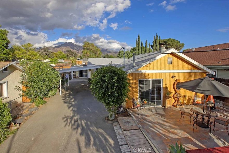 Fall in love with this adorable single story home with peaceful mountain views nestled in the beautiful Foothills. A flowing floor plan offers room and private spaces for everyone. Sliding doors in three of the four bedrooms each open to private seating areas. Catch the peaceful mountain views from so many places on the property, at sunset they are golden.  The 4th bedroom is situated at the west end of the home with its own kitchenette and living room, ideal as an in-law suite or for extended family. The sliding door off the family room could easily be turned into a separate entrance. 

A charming wood bench/eat-in kitchen and a breakfast bar/counter open to the living room, giving a spacious and welcoming feel. A sliding door off the nicely sized living room opens to a concrete patio area perfect for afternoon barbecues or sipping morning coffee. There are also covered washer and dryer hookups.

Regarding the systems, a newer roof, 2 water heaters - (one 40 gallon Reliance and one 40 gallon Rheem brand), copper plumbing and an upgraded electrical panel are a bonus. Toward the back is a storage shed to keep outdoor cushions, gardening supplies, holiday decor and more.

The spacious front yard offers so many places to relax and enjoy year round outdoor living. There is also a gravel area in front that can conveniently be used as additional room for parking. The gated yard is perfect for pets and little ones to play. This Home Sweet Home offers a great opportunity for you to add your personal touches and make it your own!