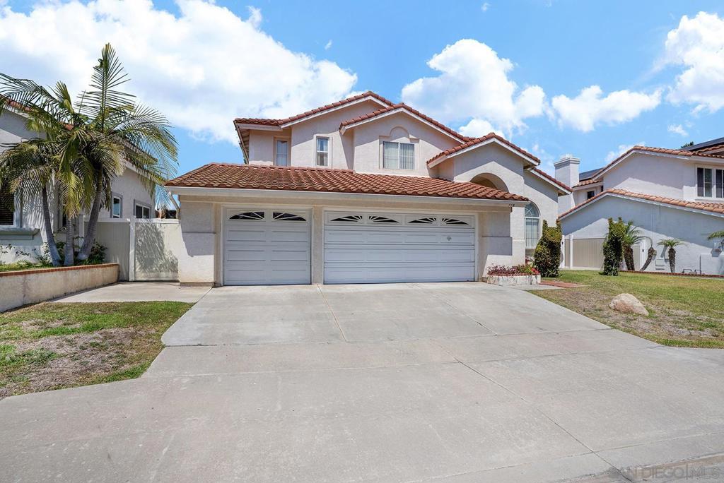 Welcome to this beautiful home in the highly sought-after Rancho Del Rey neighborhood of Chula Vista. This 4-bedroom, 3-bathroom residence offers 2,550 square feet of living space on a generous 6,301 square foot lot. Step inside and be greeted by high vaulted ceilings and an abundance of natural light in the living and dining rooms. You'll find a convenient bedroom and a full bathroom downstairs, perfect for guests or multi-generational living. The gourmet kitchen is a chef's delight, featuring a large island, countertops, and appliances. A cozy fireplace in the family room provides the perfect setting for relaxing evenings. The spacious master suite boasts cathedral ceilings and a large Roman tub, dual sinks, and a walk-in closet in the en-suite bathroom. Additional features include a three-car garage, ceramic tile and carpets, and a beautiful tiered staircase. This home is conveniently located in a peaceful subdivision with easy access to local amenities and schools.This home is located in a fantastic community known for its great schools. It's also just a short walk to beautiful parks like Paseo del Rey Park, offering open green space, picnic areas, and play equipment for the whole family to enjoy. This is an incredible opportunity to own a piece of paradise in a fantastic community.