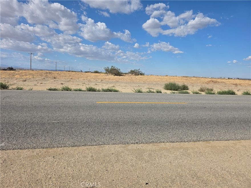 This spacious lot is conveniently located near the main road, making it perfect for RVs, semi-trucks, or anyone looking to build their dream home. Enjoy the peace of being outside the city while still staying close enough for quick access to all the amenities you need.