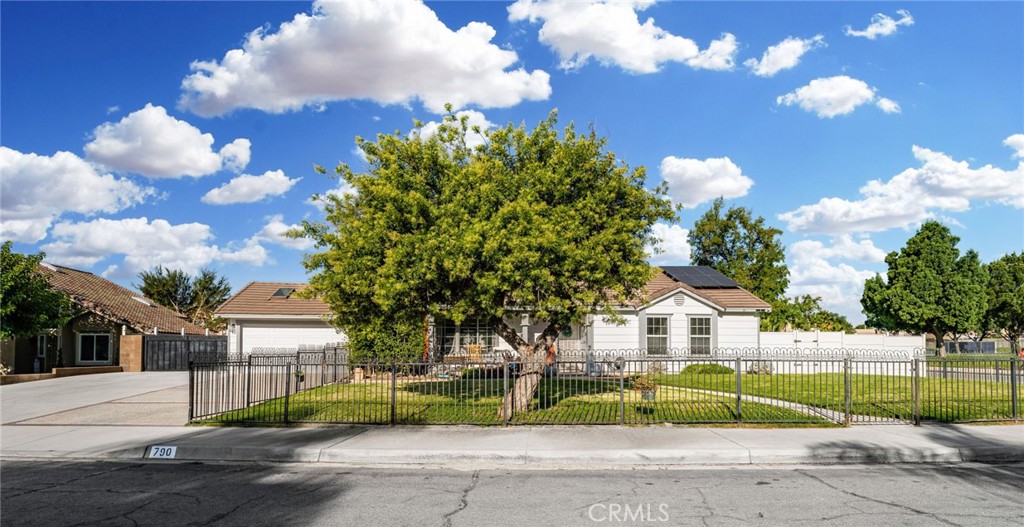 Beautiful corner home in a very desirable area of Rialto. 4 bedrooms (tax rolls show 3) , 2 baths, this home was the former model home for the builder. Open floor plan, laminate wood flooring, Formal living room with fireplace , formal dining, breakfast area, skylights, rooms have mirrored closet doors . Perfect home for entertaining - salt water pool with solar heating - 38 panel solar system (paid for) , gazebo , covered back patio, , covered front porch, fenced in front yard - Mature lemon and avocado trees ! RV parking ! Turnkey !