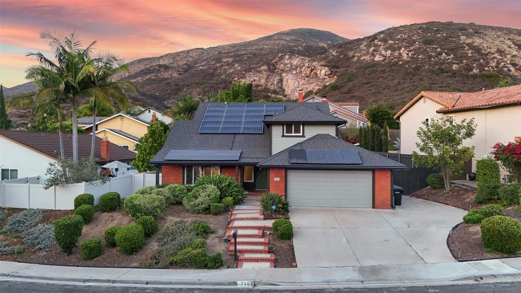 “One Block From Cowles Mountain :: Updated San Carlos Stunner With Wraparound Lot + Solar” WHAT WE LOVE: Living at Birchcreek means stepping out your door and being one block from Cowles Mountain and minutes from Lake Murray—hike, bike, fish, and play without ever starting your car. Inside, the fresh oak-tone LVP floors, vaulted ceilings, new roof and statement lighting set a modern tone, while a brick fireplace keeps the classic San Carlos vibe alive. Step out back and the magic continues: a private wraparound yard with natural grass, colorful flowers that draw butterflies, and space for pets, play, or even your RV. The functioning saltwater spa is perfect for unwinding under the stars. This is the rare blend of lifestyle + updates that buyers dream about. WHAT WE LOVE (CONT…): This four-bedroom, two-and-a-half-bath home sits in a tucked-away San Carlos pocket that feels private but keeps you just minutes to the 125, shops, and schools. Double-tempered, dual-pane windows throughout keep things efficient, quiet, and safe. Both bathrooms are tastefully upgraded, including the primary with a tiled glass-door shower. Details like oversized baseboards, cohesive custom lighting, and newly replaced modern staircase rails (both stylish and child-safe) elevate the day-to-day living experience. The backyard is a true highlight: a wide, dog-leg wraparound lot with a retaining wall, natural grass, fresh landscaping underway, and plenty of room to entertain, garden, or simply enjoy San Diego’s endless sunshine. Add solar (PPA lease) for low energy bills and RV parking on the side, and you’ve got the complete package.