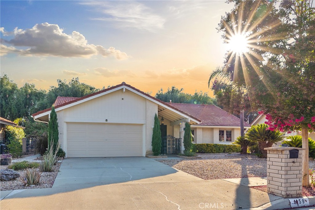 Located in the desirable Seven Hills 55+ Golf Course community, this beautifully maintained single-story detached home offers a comfortable and open floor plan perfect for everyday living. The spacious family room features a cozy fireplace, while the open kitchen boasts updated stainless steel appliances, a new sink and faucet, a dining area, and a convenient eat-at bar. The primary suite includes a sliding door to the backyard, providing easy indoor-outdoor access. You’ll also find a generously sized secondary bedroom and a third bedroom currently used as a den/office. The updated bathroom features a walk-in bathtub for added comfort and accessibility. Enjoy the outdoors year-round with both an enclosed patio and a stylish Alumawood covered patio. The spacious backyard is beautifully landscaped with mature fruit trees, lush greenery, and a concrete patio—perfect for relaxing or entertaining. Additional highlights include a two-car garage and a prime location within this sought-after community. Recent upgrades include energy-efficient dual-pane windows, updated sliding glass doors, and an updated A/C system, ensuring year-round comfort and reduced utility costs.