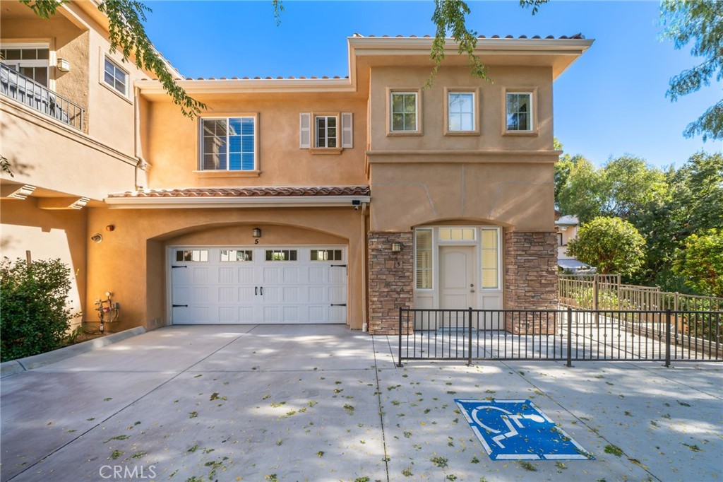 Welcome home to this stunning Agoura Hills townhome in a quiet 5 unit complex! Beautiful curb appeal leads to the quiet end unit in the back of the building with it's own private and gated patio - the only one of it's kind! Looking over the quaint garden and backyard, you will walk into an inviting entry with staircase up to the living area and spacious great room. A lovely Chef’s kitchen enjoys granite countertops, beautiful cabinetry, stainless steel appliances, NEW refrigerator, dishwasher, range, NEW microwave, built-in pantry, and a dining area. The beautiful living area has picture windows with views of the mountains, NEW luxury vinyl flooring, and tall ceilings. The top level enjoys two nice sized bedrooms with NEW comfortable carpet and features a large private bath with dual vanities and a tub/shower combo. The third bedroom, perfect for in laws, guests, or a home office, sits on the main level with a beautiful bathroom featuring granite counters and stall shower. Additional conveniences include a laundry area with NEW side by side washer/dryer, attached two car garage, and guest parking. Enjoy everything Agoura Hills has to offer, conveniently located in the Las Virgenes School District, minutes from Malibu, near fine dining, shopping, and more!