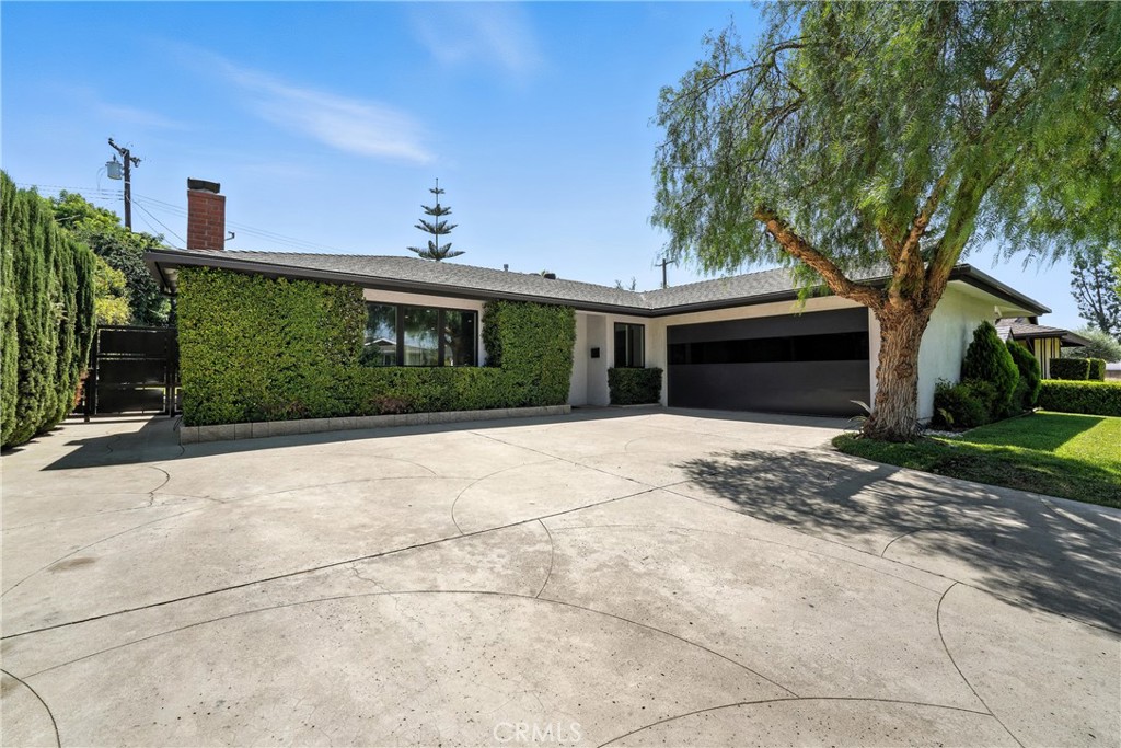 620 Hatfield isn’t just a home—it’s a statement. Designed for the homeowner who appreciates master craftsmanship and thoughtful detail, this contemporary modern residence is unlike anything else on the market. From the moment you arrive, the smooth finish stucco, custom bronze side gates, and sleek steel garage doors with tinted glass set the stage for the extraordinary living experience that awaits inside. Step through the front door into an open, light-filled floor plan where every feature was hand-selected for quality and function. Sunlight pours through new double-pane casement windows, enhanced by motorized blinds, while a custom gray chrome-plated mantel becomes the living room’s striking centerpiece. This home has been completely reimagined, with updated plumbing, electrical, central A/C and heating, plus a whole-house fan—offering both style and peace of mind. The kitchen is a showpiece, blending design and utility seamlessly. A porcelain waterfall island, Viking appliances, and custom push-to-open cabinetry create a chef’s dream, while a pull-out custom pantry with premium hardware and a wall of windows allows natural light to dance across every finish. Throughout the home, solid walnut, frameless doors and custom closet organizers reflect a commitment to quality at every turn. Both bathrooms are fully renovated, including a hallway bath featuring a one-of-a-kind 1880’s safe vanity, supported by authentic 1920 Chevy jacks—a true work of functional art. Step outside to a private backyard retreat designed for both entertaining and unwinding. Surrounded by mature Eugenia privacy trees, you’ll enjoy a floating Viking BBQ setup, custom steel pergola, and a serene, resort-like atmosphere perfect for California living. This is not a standard remodel—it’s a true custom build where luxury and craftsmanship meet. If you appreciate the art of quality living, 620 Hatfield is a must-see.