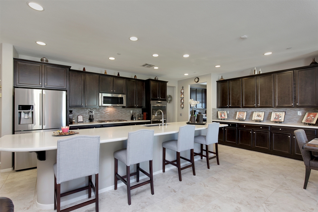 BETTER THAN THE MODELS! GORGEOUS HOME HAS EVERYTHING YOU ARE LOOKING FOR! HUGE GOURMET KITCHEN W/GRANITE SLAB ISLAND THAT IS OVER 14 FT. LONG & S.S. APPL. UPGRADED CABINETS & SEPARATE BUTLER’S PREP KITCHEN W/LARGE WALK-IN PANTRY & SEPARATE OFFICE AREA BUILT-IN DESK. FORMAL DINING ROOM W/ENORMOUS FAMILY ROOM OVERLOOKING THE BEAUTIFUL MOUNTAINS! ITALIAN TILES W/PLUSH CARPETING AND DESIGNER PAINT! HAS 2 MASTER SUITES WITH A VERY PRIVATE BACKYARD WITH AMAZING MOUNTAIN VIEWS! PROFESSIONAL LANDSCAPING & SOLAR! BETTER THAN THE MODELS! THIS GORGEOUS EXECUTIVE SINGLE STORY TURN-KEY HOME HAS EVERYTHING YOU ARE LOOKING FOR! HUGE GOURMET KITCHEN WITH GRANITE SLAB ISLAND THAT IS ALMOST 15 FEET LONG AND MATCHING COUNTER TOPS WITH GLASS TILED BACKSPLASH AND STAINLESS STEEL APPLIANCES WITH PLENTY OF UPGRADED CABINETS & HARDWARE AND SOFT CLOSE DRAWERS FOR EXTRA STORAGE AND A SEPARATE BUTLER’S PREP KITCHEN WITH LARGE WALK-IN PANTRY AND COMES WITH A SEPARATE OFFICE AREA WITH BUILT-IN DESK. LARGE FORMAL DINING ROOM THAT LEADS TO A PRIVATE COVERED PORCH AREA AND HAS ENORMOUS FAMILY ROOM OVERLOOKING THE BEAUTIFUL MOUNTAINS! UPGRADED 18X18 ITALIAN TILES WITH PLUSH CARPETING THAT IS PET STAIN RESISTANT, A/C, SECURITY SYSTEM, TERMITE PEST CONTROL SYSTEM,TANKLESS WATER HEATER, CUSTOM 8 FEET DOORS, CUSTOM DRAPES WITH LOTS OF ENERGY EFFICIENT WINDOWS AND PLENTY OF NATURAL LIGHTING AND HAS LARGE LAUNDRY ROOM WITH SINK AND TONS OF CABINETS! ENORMOUS MASTER SUITE WITH A VIEW AND WALK-IN CLOSET & GREAT MASTER BATH WITH DUAL SINK AND SEPARATE SHOWER & TUB. SECOND BEDROOM IS A JR. SUITE AND ALL OTHER BEDROOMS ARE VERY SPACIOUS AND THE ENTIRE HOME HAS DESIGNER PAINT & DECORATIVE LIGHT & SOCKET PLATES THROUGHOUT! VERY PRIVATE BACKYARD WITH AMAZING MOUNTAIN VIEWS & SUNSETS! LARGE ALUMAWOOD PATIO COVER WITH FANS & LIGHTS THAT IS MADE FOR ENTERTAINING SURROUNDED BY PROFESSIONAL LANDSCAPING WITH LIGHTING AND CUSTOM HARDSCAPE WITH TREES AND GRASS AREA AND AUTOMATIC SPRINKLER SYSTEM FOR EASY MAINTENAN...